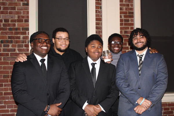 Five TRIO students pose for a photo in formal attire.