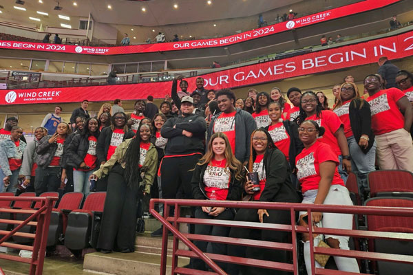 TRIO students pose for a group photo at a Chicago Bulls game.